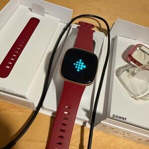 Fitbit Versa 4 Smartwatch with Burgundy Band pre owned, excellent condition